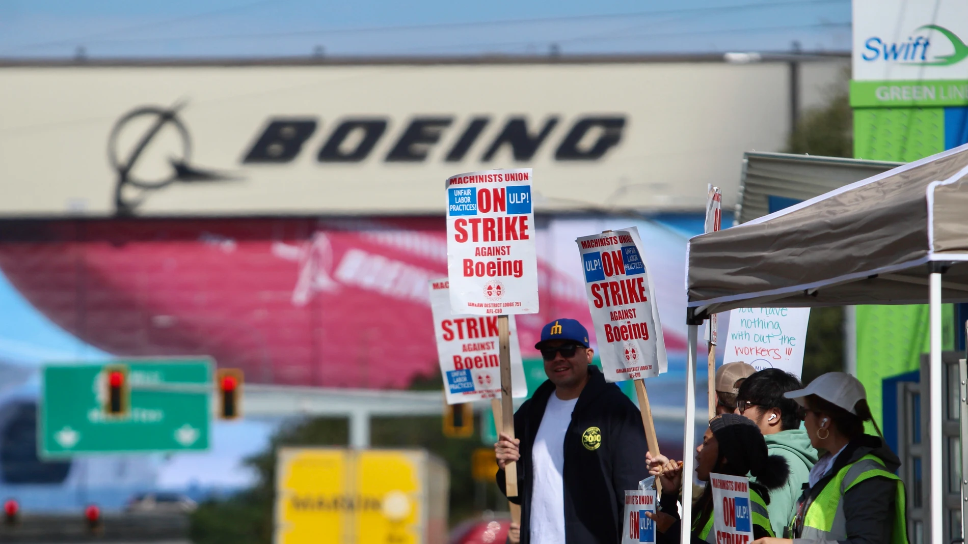 Union machinists and supporters wave picket signs in Everett, Washington, Thursday, Sept. 19, 2024, near a Boeing factory. (AP Photo/Manuel Valdes)