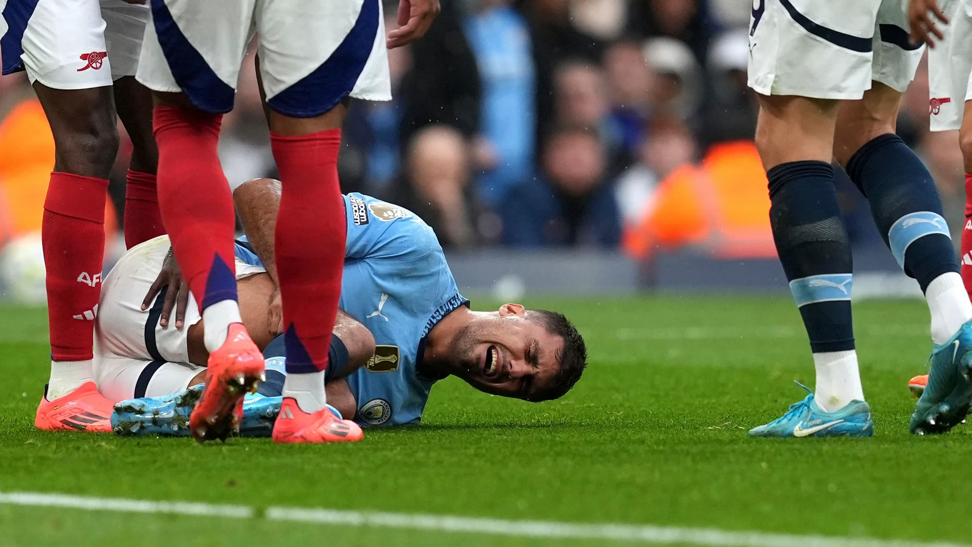 Manchester City's Rodri reacts to an injury, during the English Premier League soccer match between Manchester City and Arsenal at the Etihad stadium in Manchester, England, Sunday, Sept. 22, 2024. ( Martin Rickett/PA via AP)