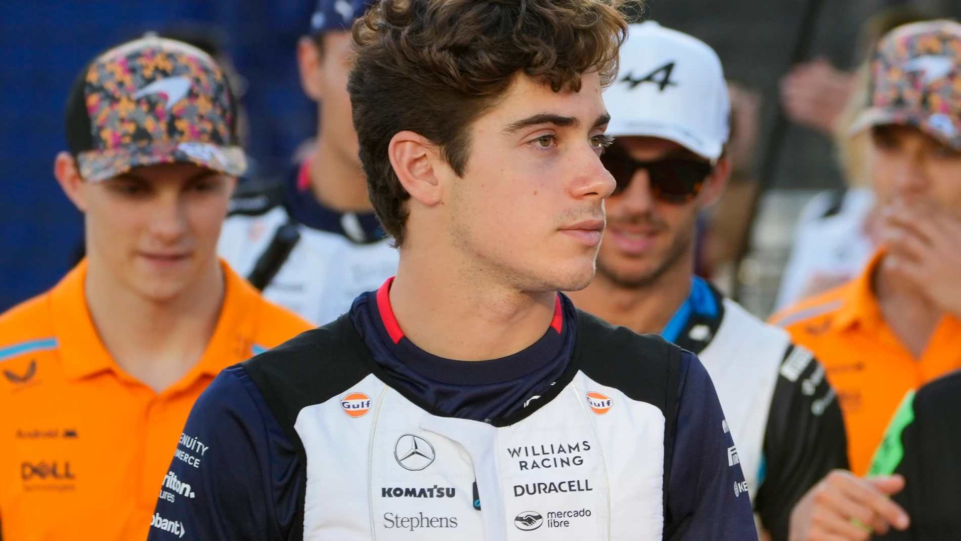 Williams driver Franco Colapinto, of Argentina walks to the drivers parade ahead of the Singapore Formula One Grand Prix at the Marina Bay Street Circuit, in Singapore, Sunday, Sept. 22, 2024. (AP Photo/Vincent Thian)