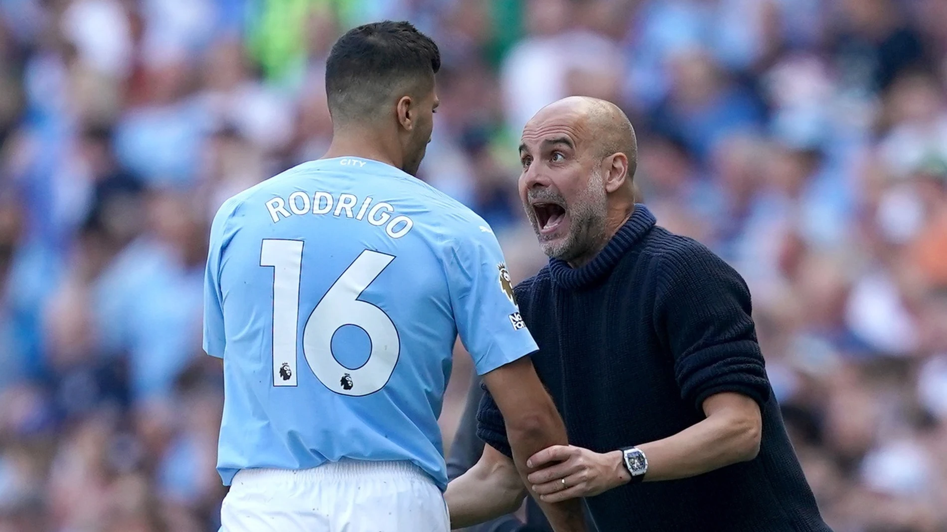 El jugador español Rodri Hernández (Manchester City), junto a su entrenador, Pep Guardiola. MARTIN RICKETT/PA WIRE/DPA 25/09/2024 ONLY FOR USE IN SPAIN