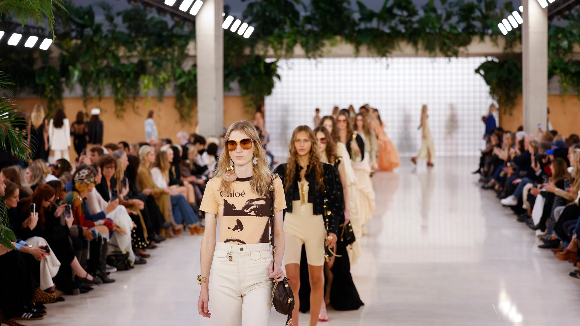 Models wear creations as part of the Chloe Spring/Summer 2025 collection presented Thursday, Sept. 26, 2024, in Paris. (Photo by Vianney Le Caer/Invision/AP)