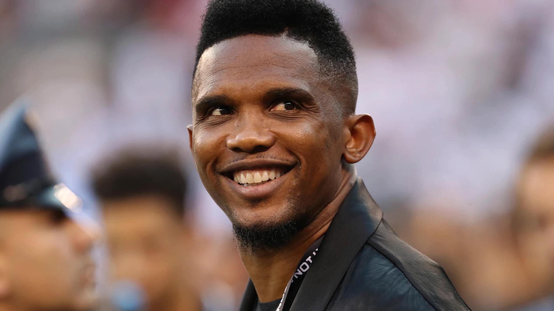 FILE - Soccer player Samuel Eto'o watches warmups before an International Champions Cup soccer match between Atletico Madrid and Real Madrid on July 26, 2019, in East Rutherford, N.J. (AP Photo/Steve Luciano, File)