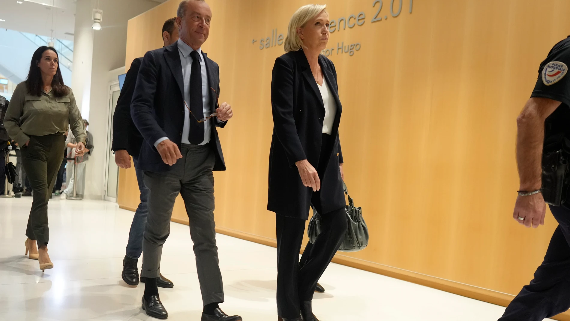 French far-right leader Marine Le Pen, right, leaves the court house after the first day of trial in Paris, Monday, Sept. 30, 2024. (AP Photo/Thibault Camus)