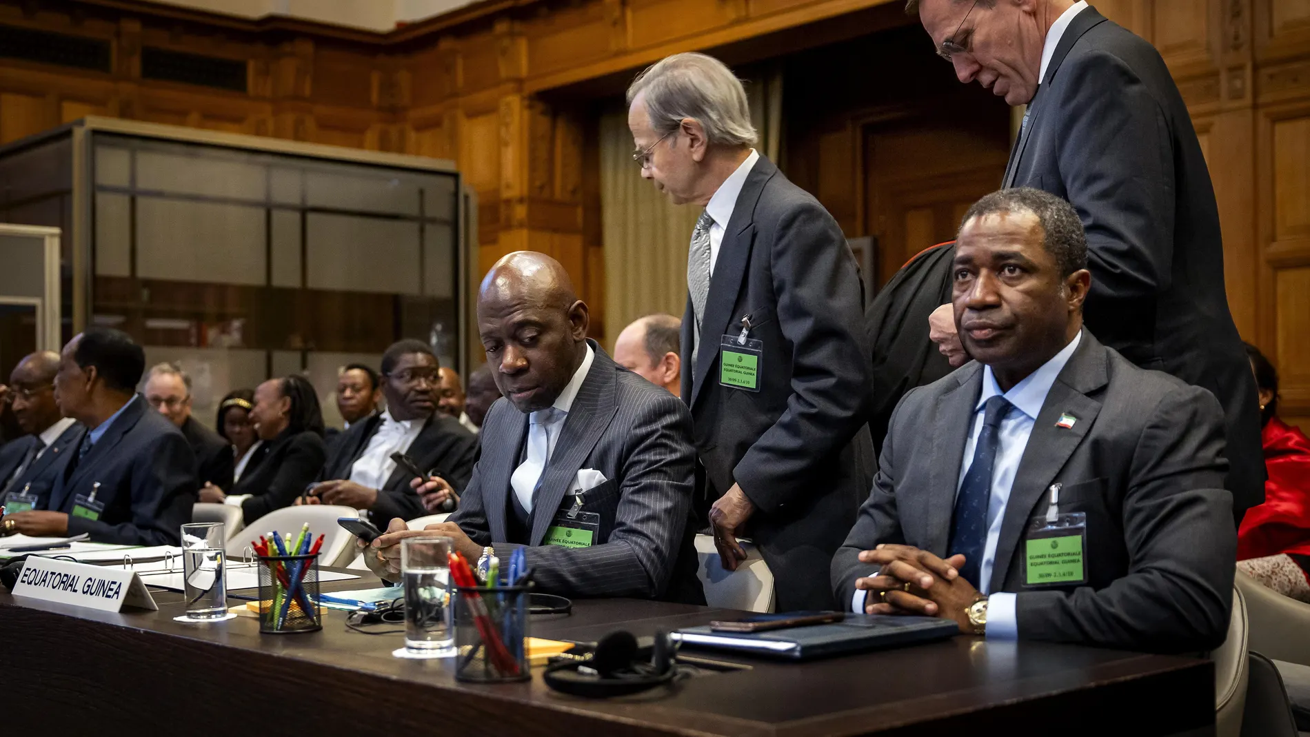 The Hague (Netherlands), 30/09/2024.- Ambassador of Equatorial Guinea to France Carmelo Nvono Nca (C) and Minister of Mines & Hydrocarbons Republic of Equatorial Guinea Domingo Mba Esono (R) attend the public hearings regarding the case related to Land, Maritime Delimitation, and Sovereignty over Islands between Gabon and Equatorial Guinea, held at the Peace Palace in The Hague, Netherlands, 30 September 2024. The ICJ will hold the public hearings between Gabon and Equatorial Guinea to resolv...