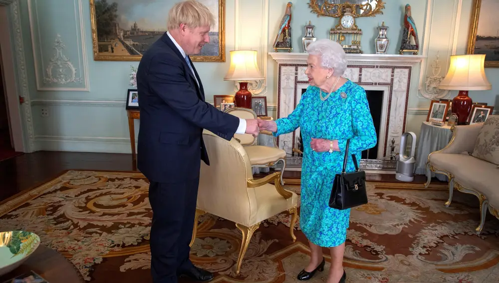 Britain's Queen Elizabeth II welcomes newly elected leader of the Conservative party Boris Johnson during an audience in Buckingham Palace