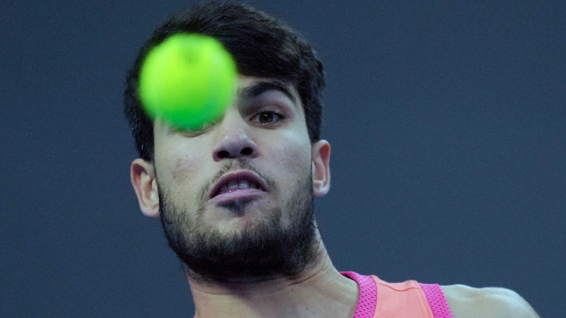 Carlos Alcaraz of Spain returns a shot from Jannik Sinner of Italy during their men's singles finals match of the China Open tennis tournament, at the National Tennis Center in Beijing, Wednesday, Oct. 2, 2024. (AP Photo/Achmad Ibrahim)