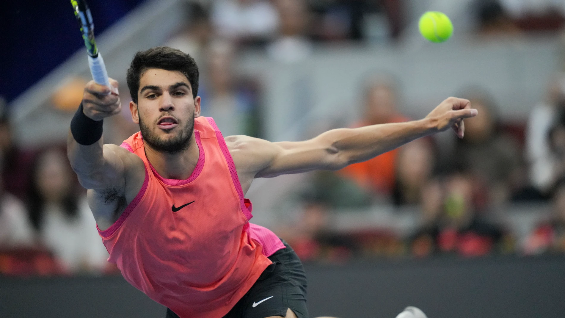 Carlos Alcaraz of Spain returns a shot from Jannik Sinner of Italy during their men's singles finals match of the China Open tennis tournament, at the National Tennis Center in Beijing, Wednesday, Oct. 2, 2024. (AP Photo/Achmad Ibrahim)