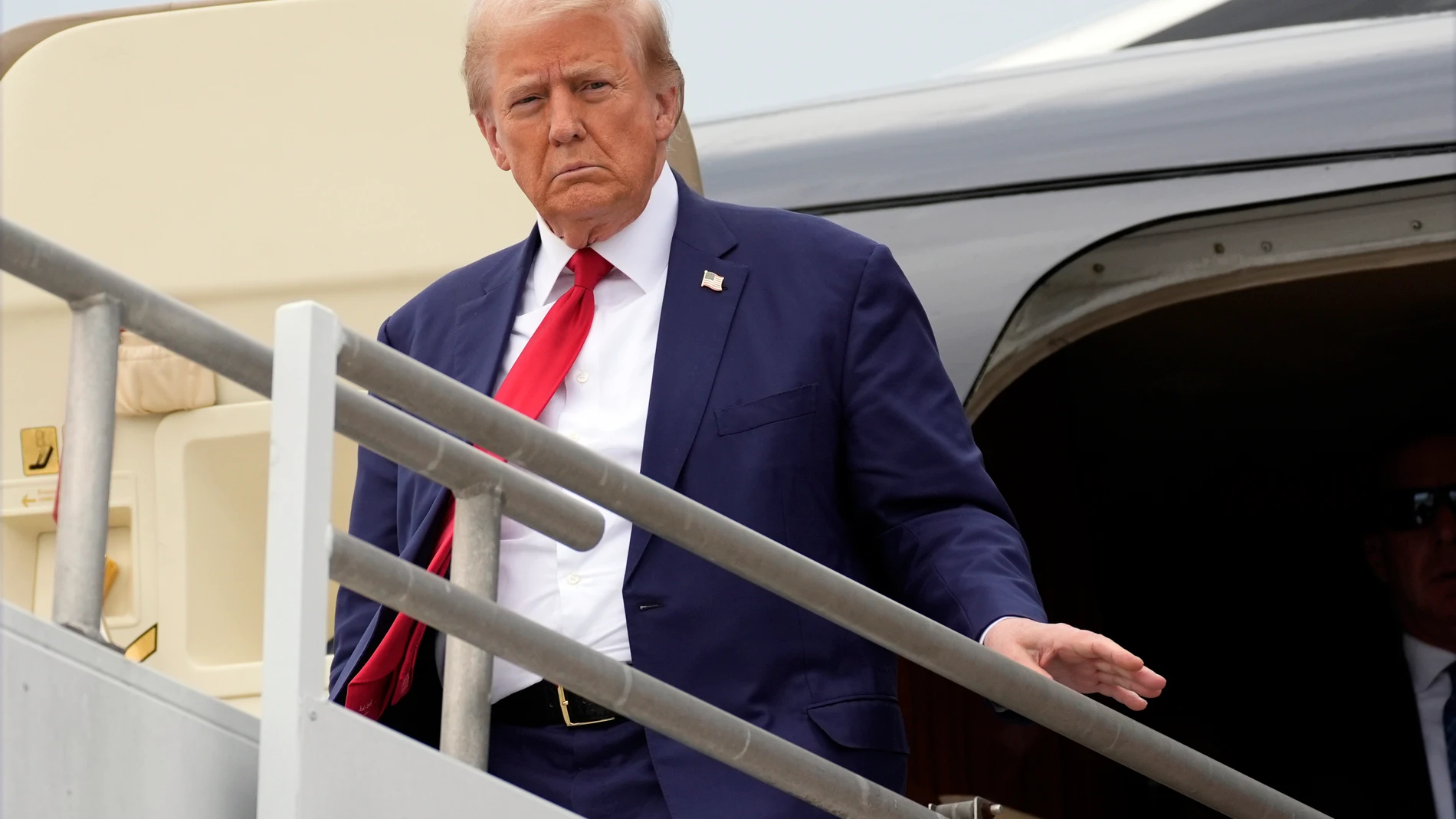 Republican presidential nominee former President Donald Trump arrives at Augusta Regional Airport to visit areas impacted by Hurricane Helene, Friday, Oct. 4, 2024, in Augusta, Ga. (AP Photo/Evan Vucci)