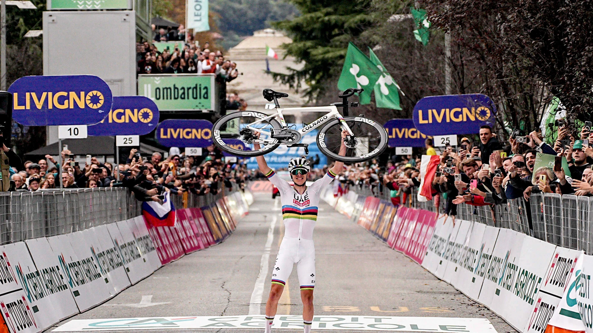 Reigning World Champion Slovenia's Tadej Pogacar celebrates winning Il Lombardia, Tour of Lombardy cycling race, in Como, Italy, Saturday, Oct. 12, 2024. (Marco Alpozzi/LaPresse via AP)