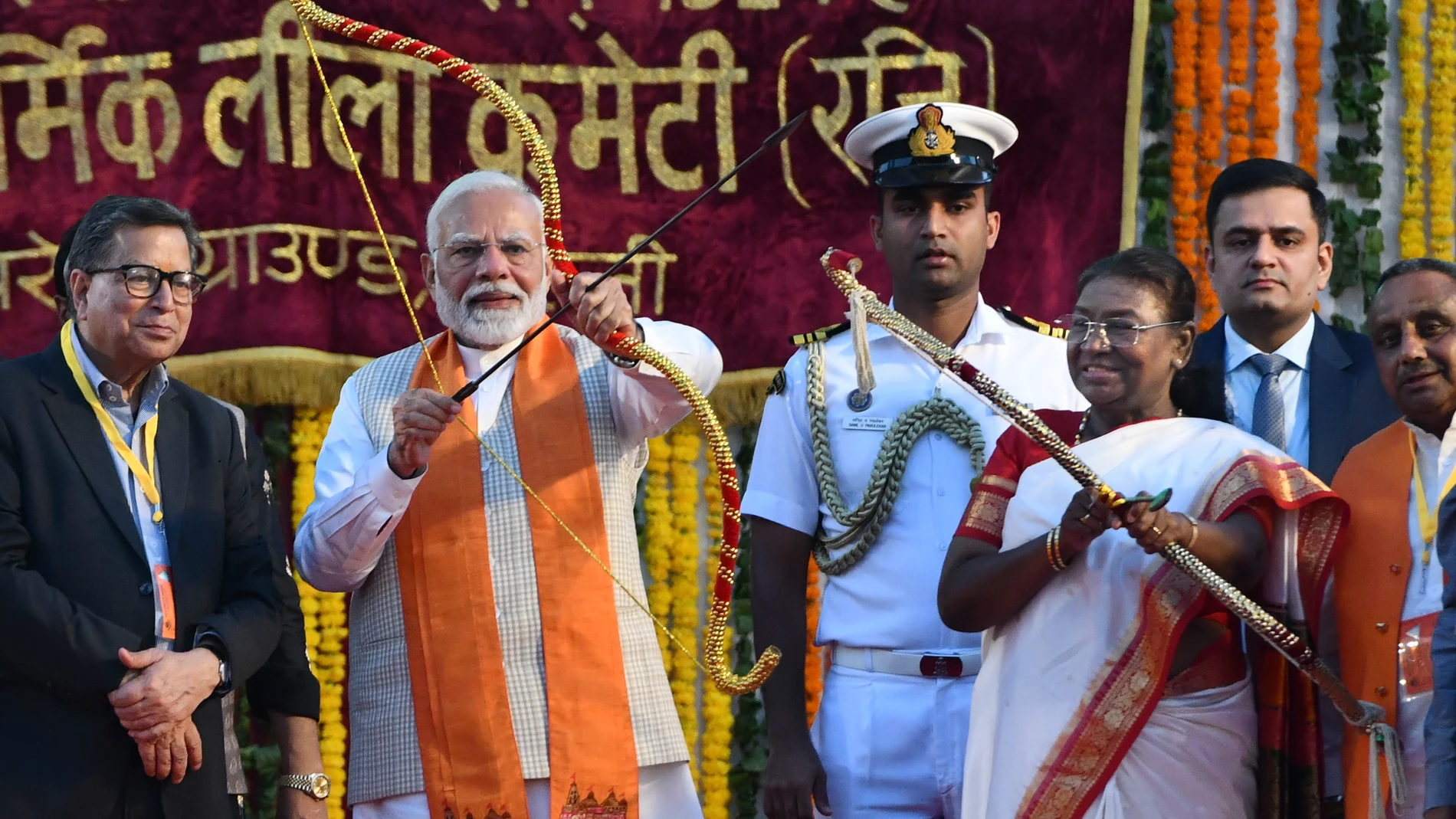 Indian Prime Minister Narendra Modi, second left, with Indian President Droupadi Murmu, third from right, aim the arrow at the effigy of demon king Ravana, marking the end of Dussehra festival in New Delhi, India, Saturday, Oct. 12, 2024. Dussehra commemorates the triumph of Hindu god Rama over the demon king Ravana, marking the victory of good over evil. (AP Photo)
