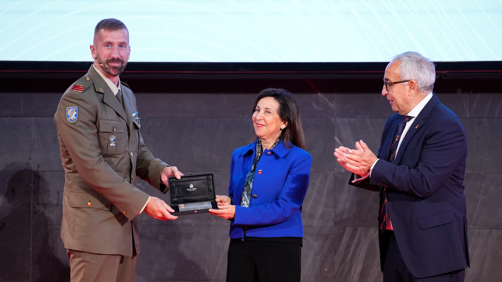 Carlos Arevalo gives a plaque to Margarita Robles, Minister of Defense of Spain, with Alejandro Blanco, President of the Spanish Olympic Committee COE, during a joint event of the Spanish Olympic Committee (COE) and the Spanish Ministry of Defense on elite military athletes at the COE headquarters on October 14, 2024, in Madrid, Spain. AFP7 14/10/2024 ONLY FOR USE IN SPAIN