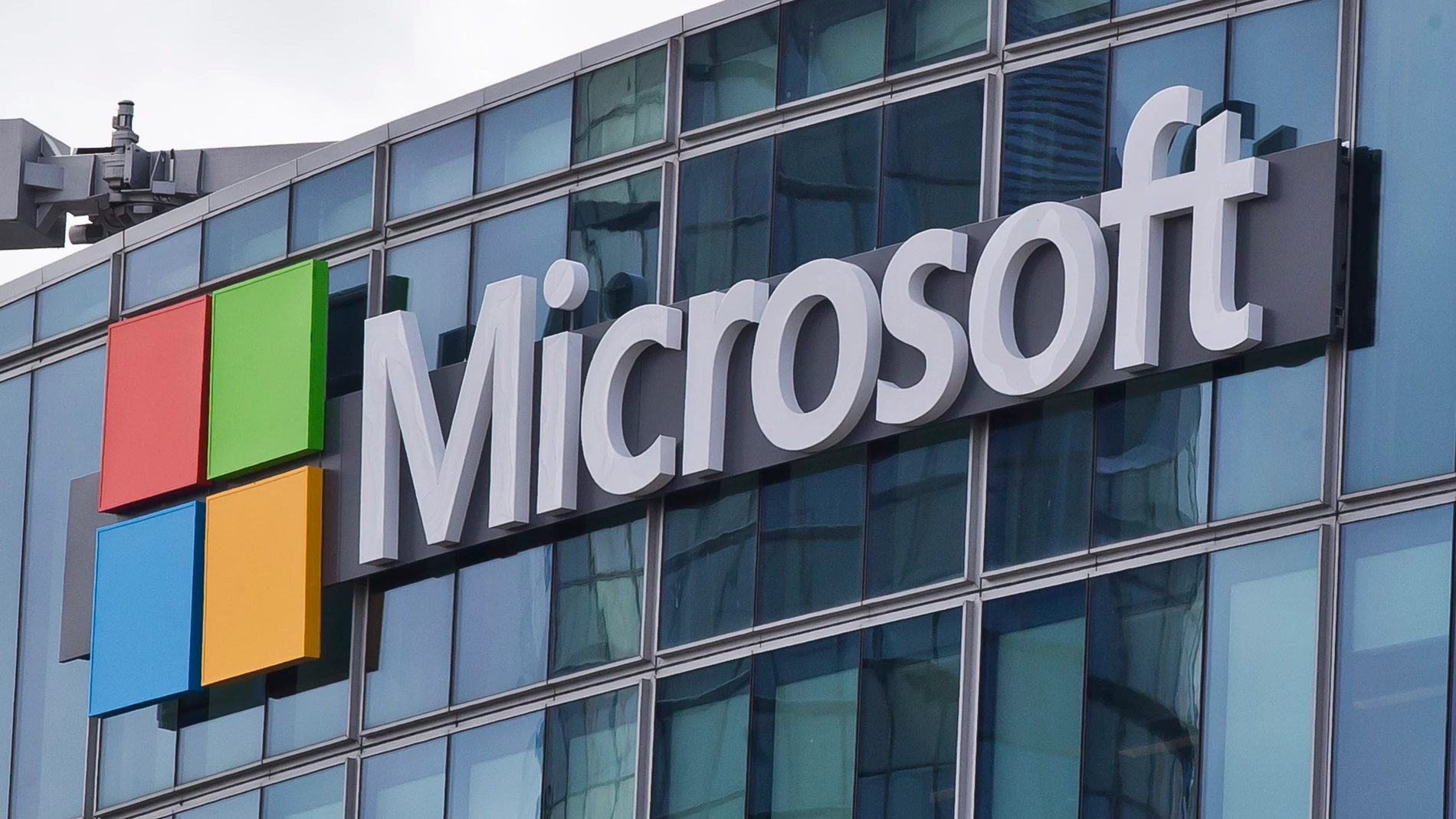 FILE - This April 12, 2016, file photo shows the Microsoft logo in Issy-les-Moulineaux, outside Paris, France. Russia, China and Iran are expanding their partnerships with cyber criminals to conduct cyberespionage and cyberattacks against the U.S. and other nations, according to a new report from Microsoft. Analysts at the tech giant say partnerships between authoritarian governments and criminal networks have benefits for both sides, increasing the volume and effectiveness of the cyber opera...