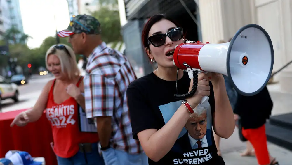 Laura Loomer shows her support for former President Donald Trump outside a campaign event for Republican presidential candidate Florida Gov. Ron DeSantis at The Vault on October 05, 2023 in Tampa, Florida. Ron DeSantis held the campaign event with Florida sheriffs after receiving endorsements from 60 bipartisan Florida law enforcement officers.
