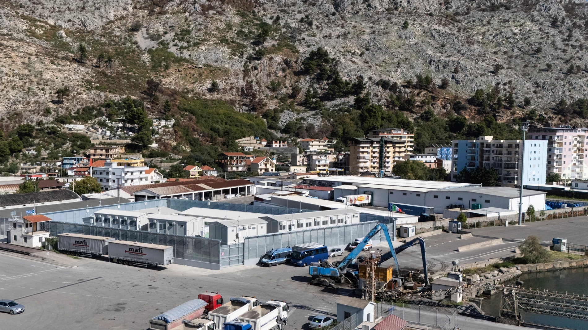 A general view of a migrant processing center at the port of Shengjin, northwestern Albania Wednesday, Oct. 16, 2024, as the first group of migrants who were intercepted in international waters arrived Wednesday. (AP Photo/Vlasov Sulaj)