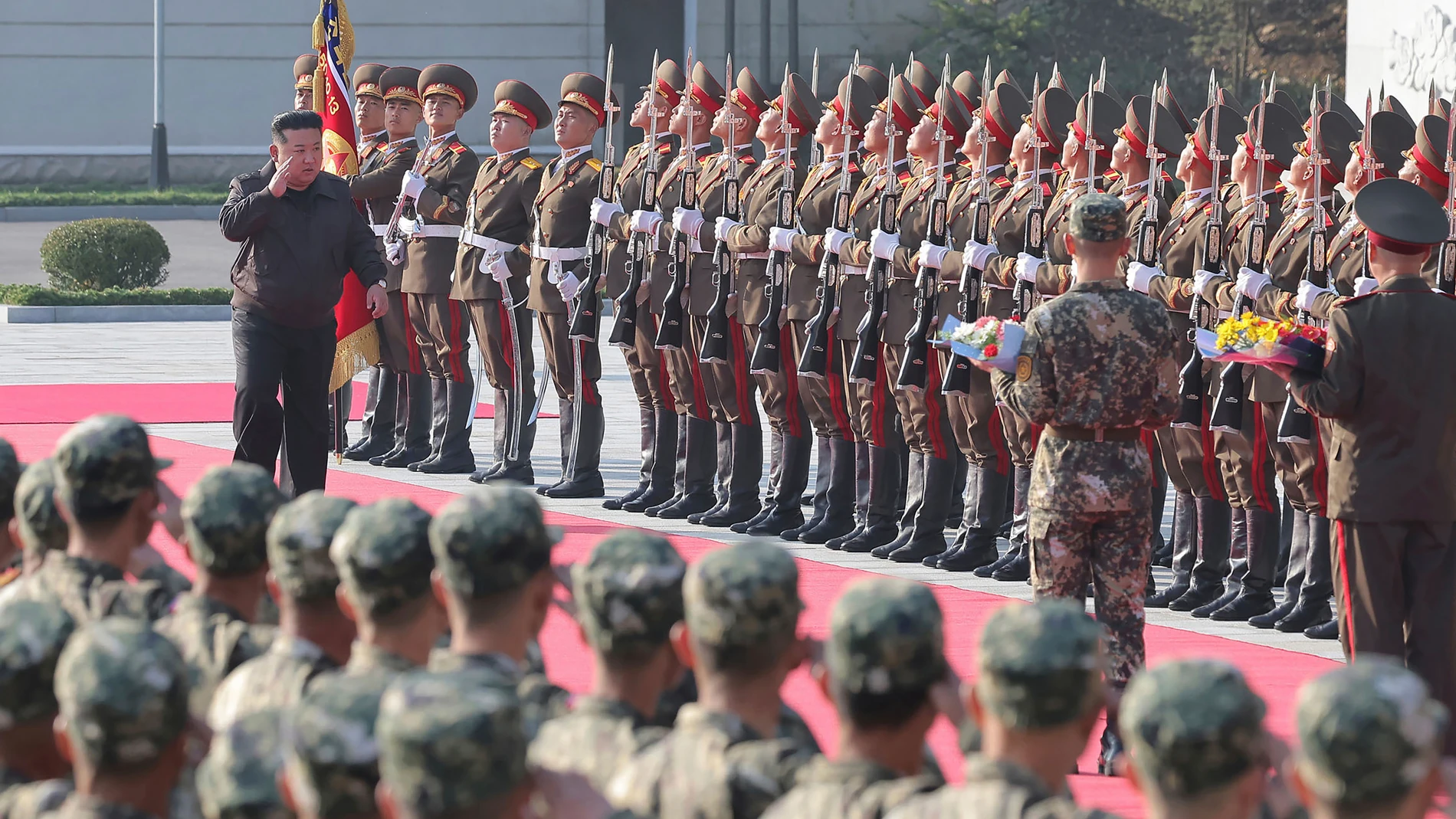 In this photo provided by the North Korean government, North Korean leader Kim Jong Un, left on red carpet, visits the headquarters of the North Korean People’s Army’s 2nd Corps at an undisclosed place in North Korea Thursday, Oct. 17, 2024. Independent journalists were not given access to cover the event depicted in this image distributed by the North Korean government. The content of this image is as provided and cannot be independently verified. (Korean Central News Agency/Korea News Servi...