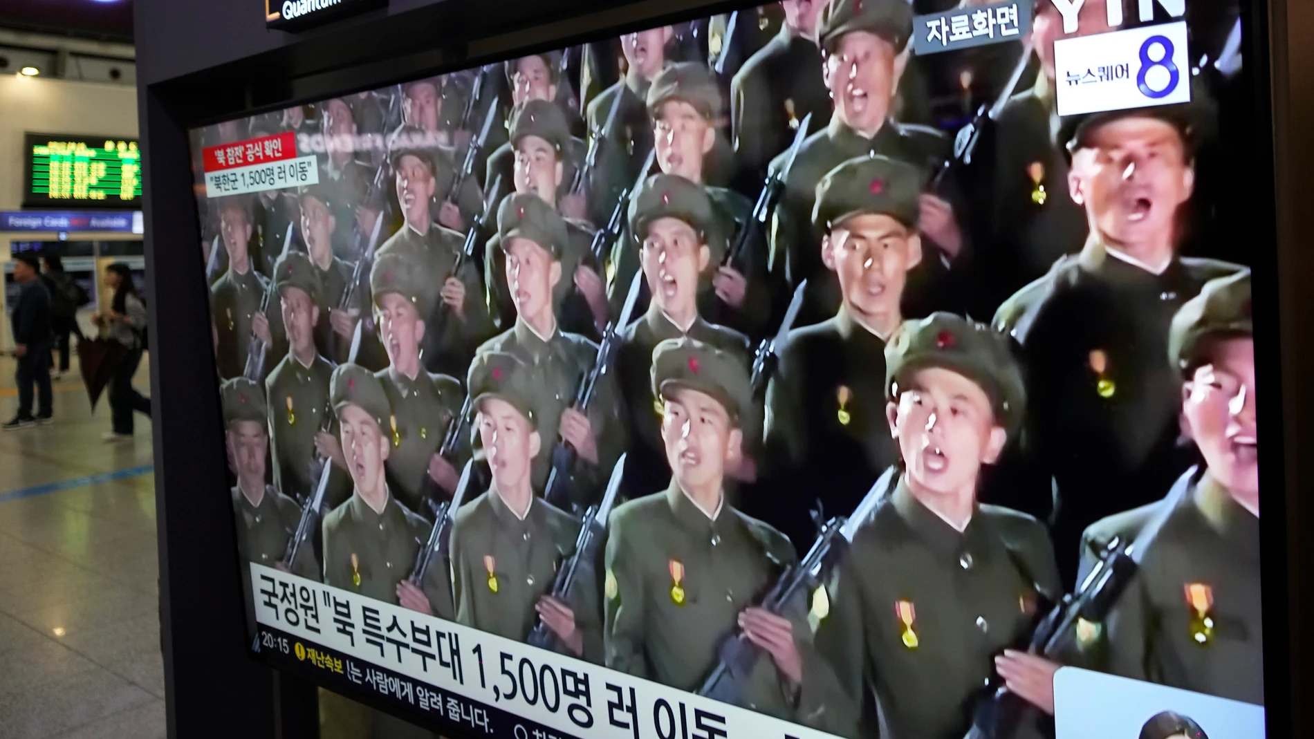 A TV screen shows file images of North Korean soldiers during a news program at Seoul Railway Station in Seoul, South Korea, Friday, Oct. 18, 2024. (AP Photo/Ahn Young-joon)