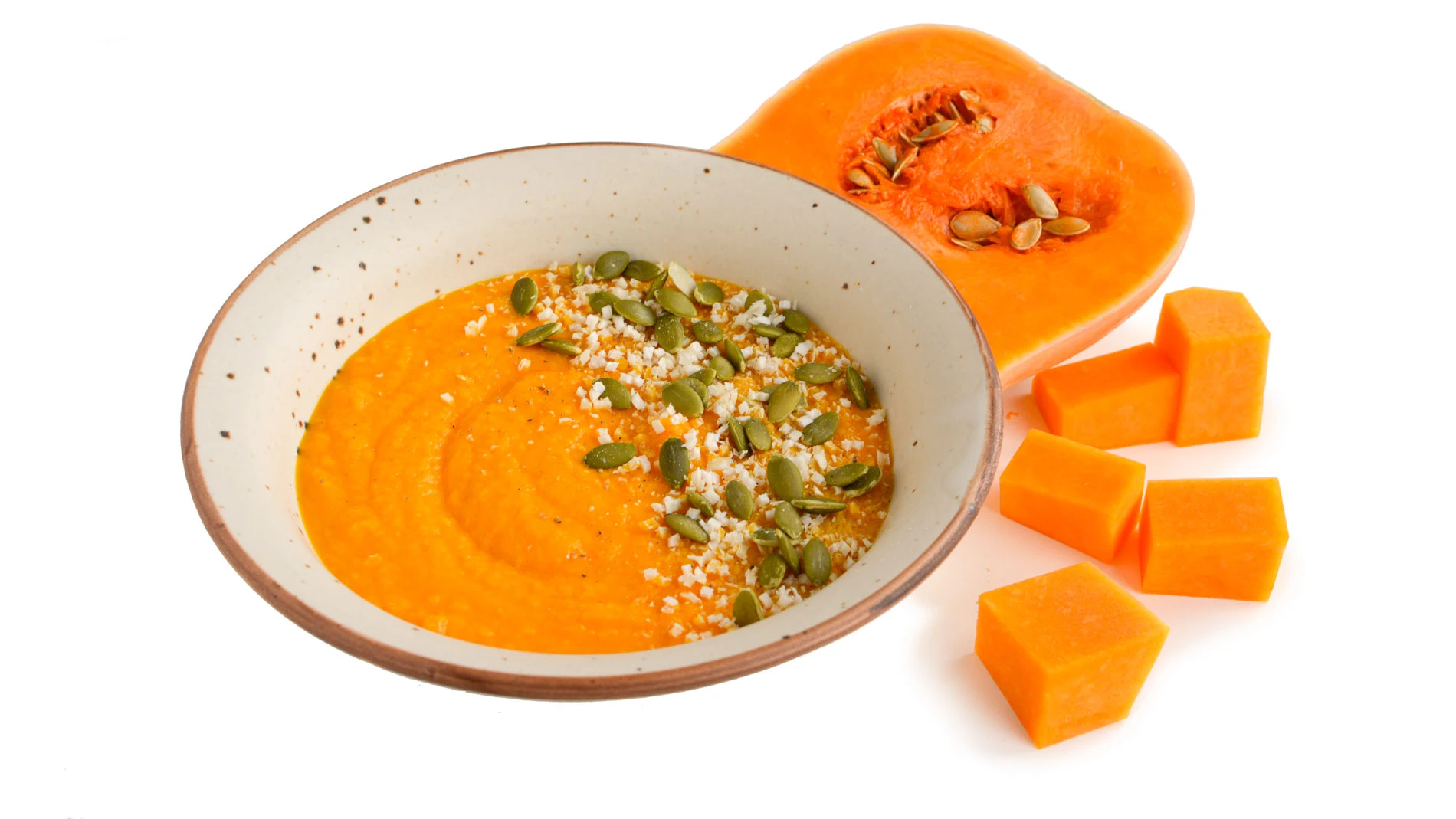 Cuenco de crema de calabaza y calabaza cortada