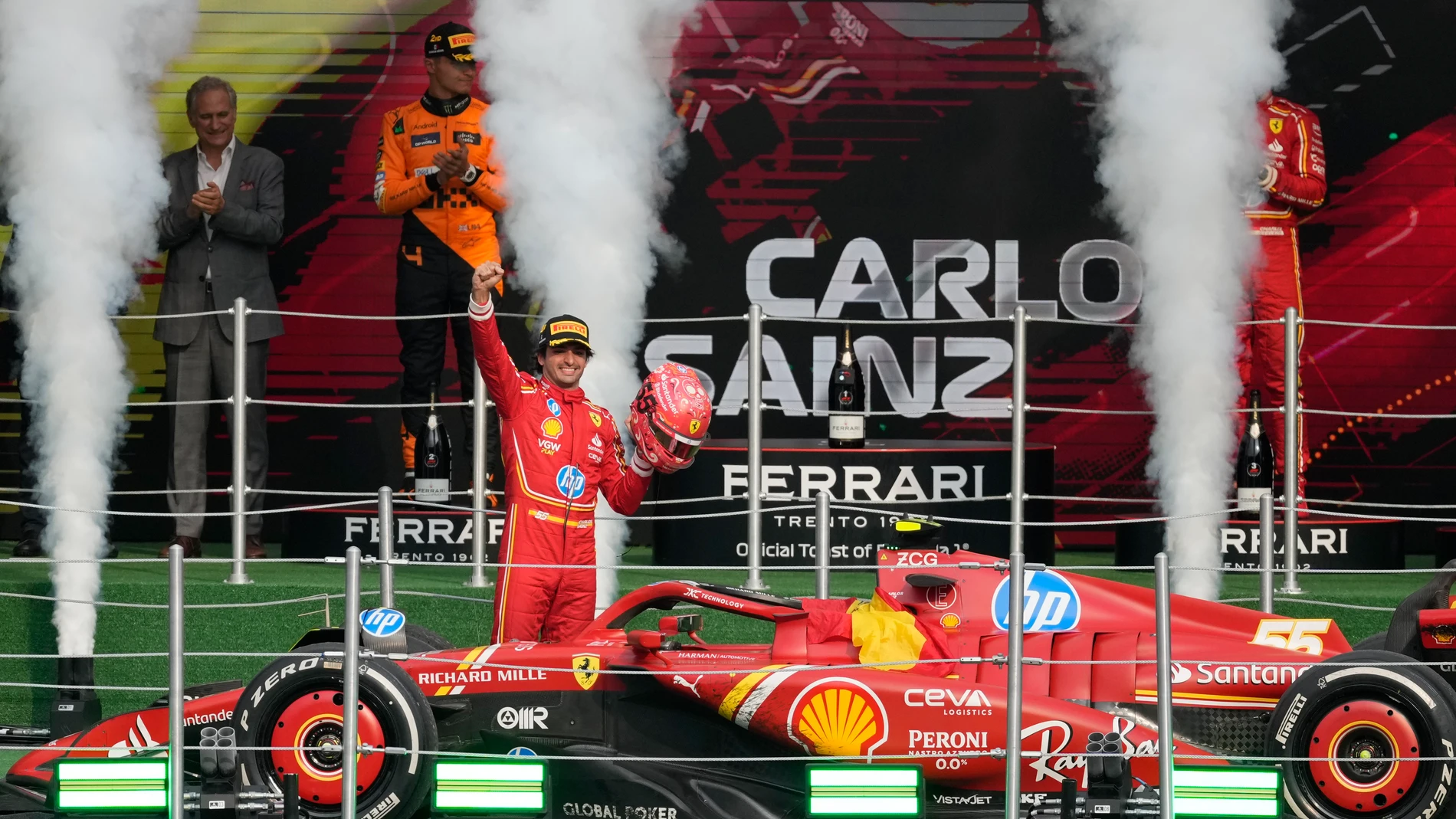 Ferrari driver Carlos Sainz of Spain celebrates after winning the Formula One Mexico Grand Prix auto race at the Hermanos Rodriguez racetrack in Mexico City, Sunday, Oct. 27, 2024. (AP Photo/Eduardo Verdugo)