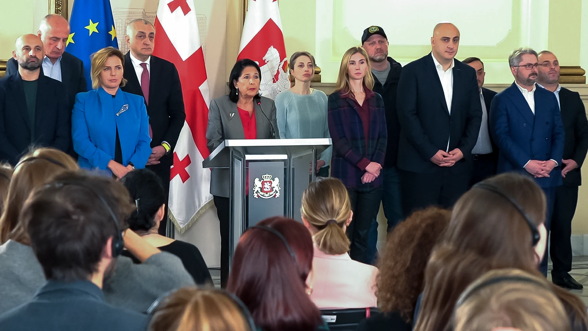 In this photo taken from video, Georgian President Salome Zourabichvili, center, surrounded by opposition leaders speaks to the media after the parliamentary election in Tbilisi, Georgia, on Sunday, Oct. 27, 2024. (AP Photo/Kostya Manenkov)