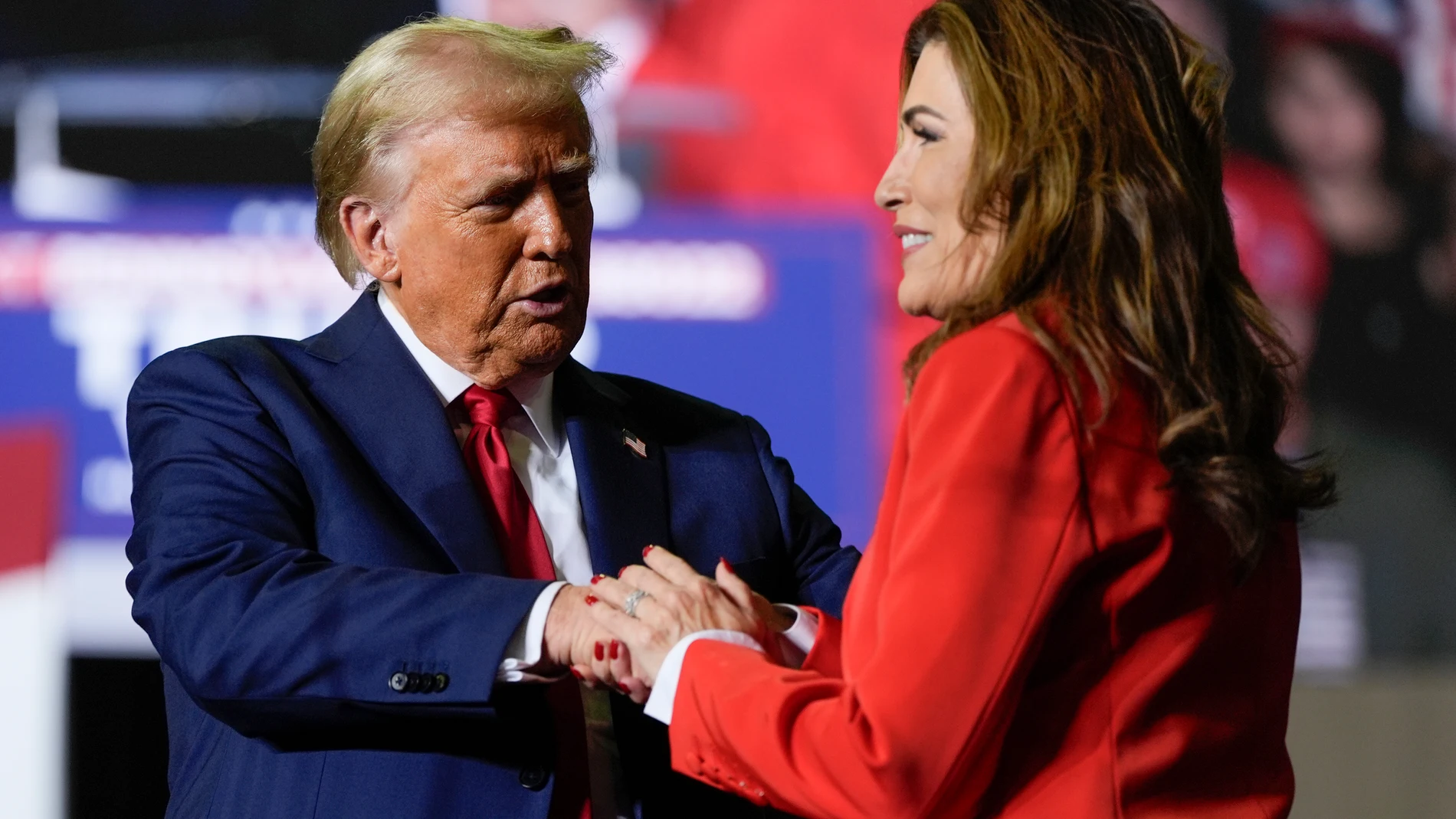 Republican presidential nominee former President Donald Trump greets Puerto Rico's shadow U.S. senator, Zoraida Buxo, at a campaign rally in Allentown, Pa., Tuesday, Oct. 29, 2024. (AP Photo/Julia Demaree Nikhinson)