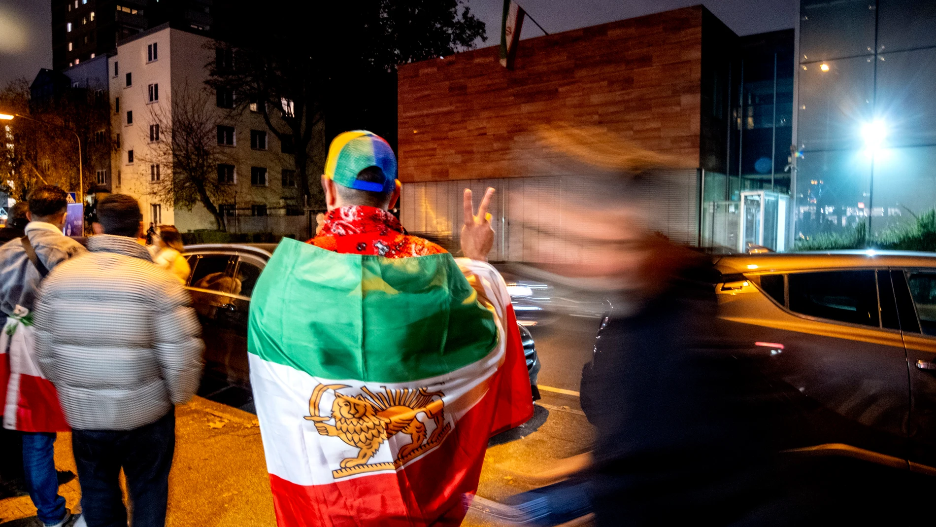 Iranians living in Frankfurt gather in front of the Iranian Consulate that was shut down in response to the execution of Iranian German prisoner Jamshid Sharmahd, who lived in the United States and was kidnapped in Dubai in 2020 by Iranian security forces, in Frankfurt, Germany, Thursday, Oct. 31, 2024. (AP Photo/Michael Probst)
