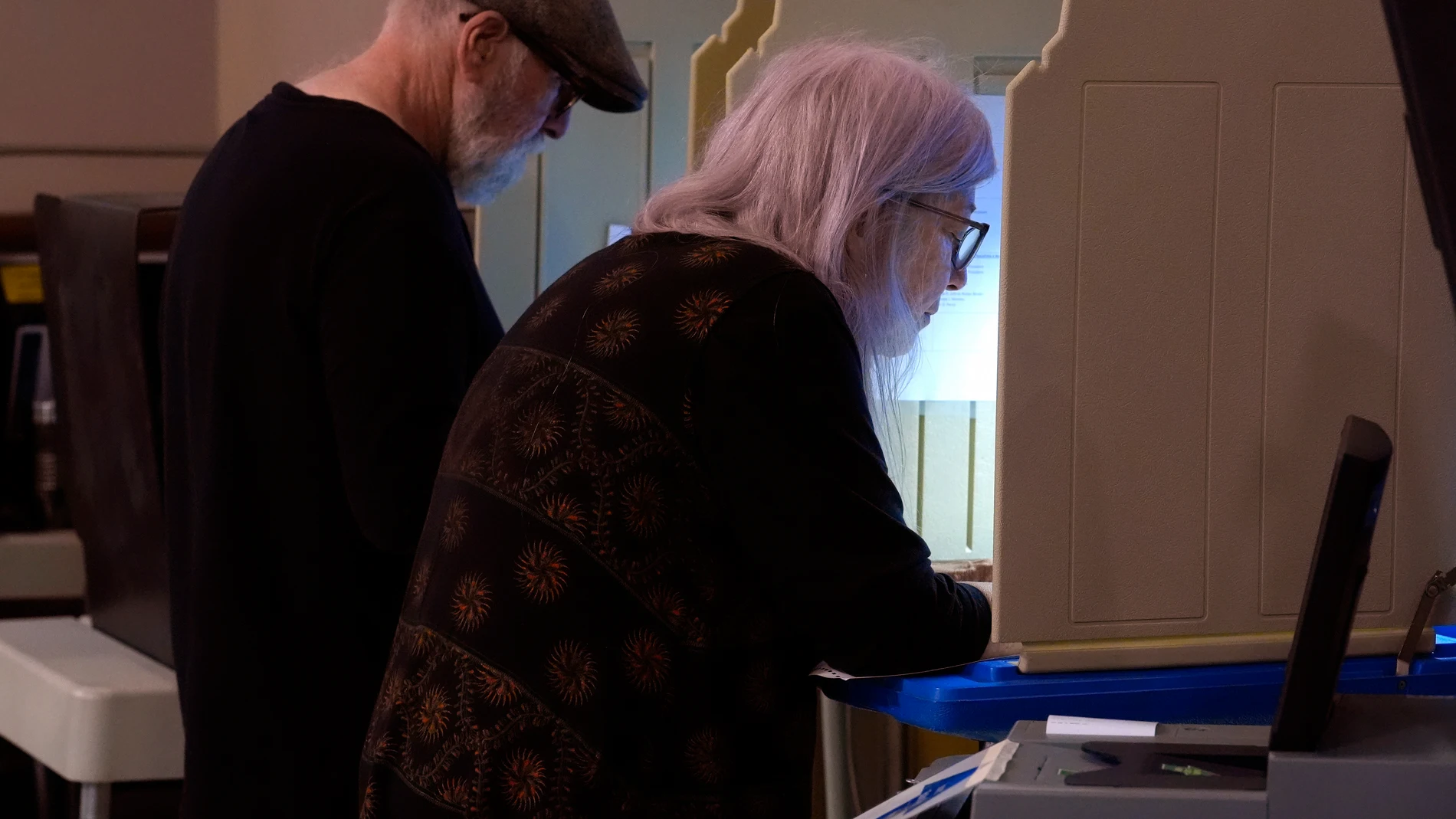 Voters mark their ballots during early voting in the general election, Friday, Nov. 1, 2024, at City Hall in Providence, R.I. (AP Photo/Steven Senne)