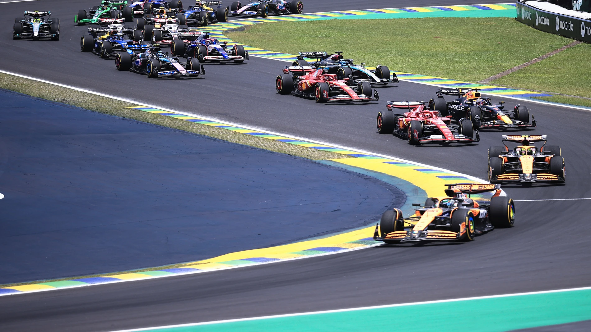 McLaren driver Oscar Piastri of Australia, bottom, leads the pack during the sprint race ahead of the Brazilian Formula One Grand Prix auto race at the Interlagos racetrack in Sao Paulo, Saturday, Nov. 2, 2024. (AP Photo/Ettore Chiereguini)