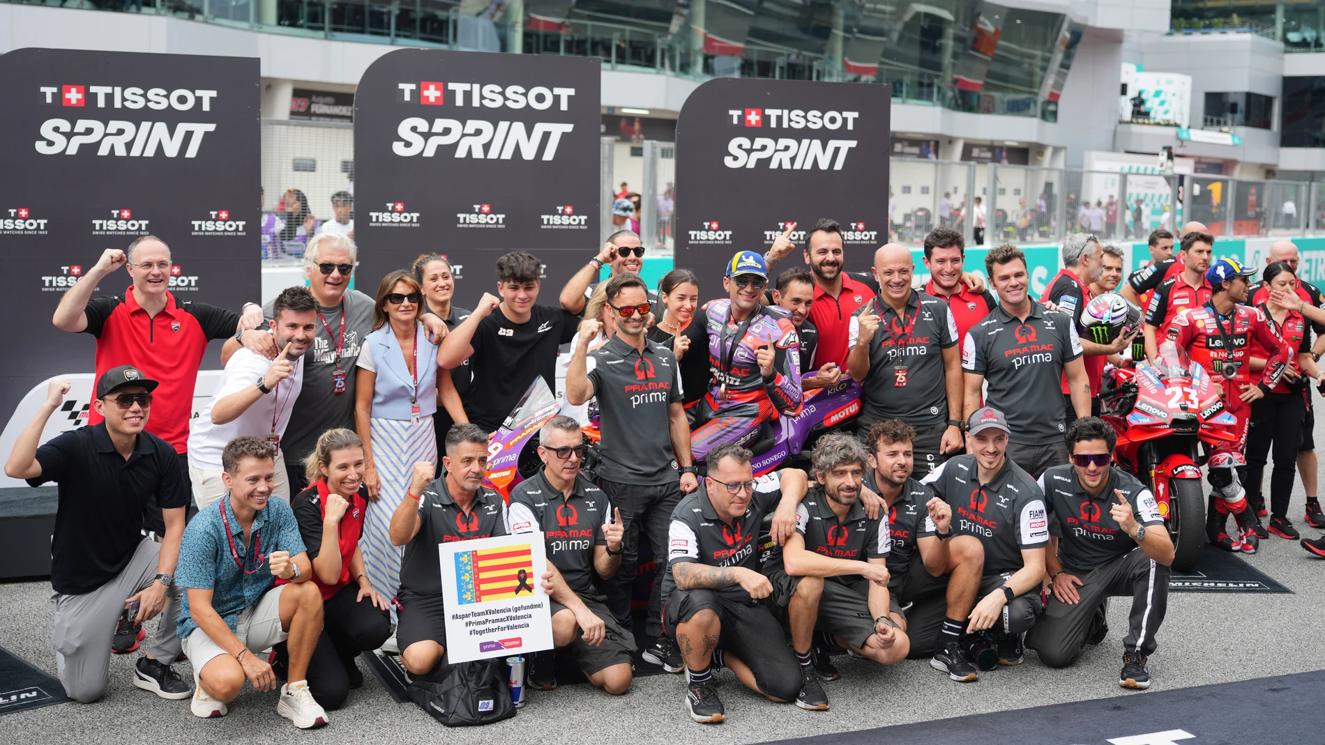 Spanish rider Jorge Martin of Prima Pramac Racing celebrates with his team after winning the sprint race at Sepang International Circuit ahead of MotoGP race in Sepang, outskirts of Kuala Lumpur, Saturday, Nov. 2, 2024. (AP Photo/Vincent Thian)