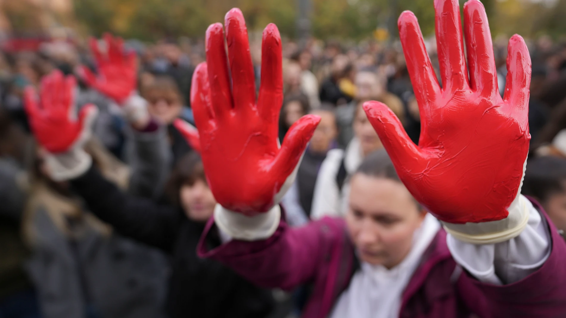 Protesters shout slogans with red paint on thire hands symbolizing blood, demanding arrests, two days after a concrete canopy collapsed at a railway station in Novi Sad, killing 14 people and injuring three, during a protest in Belgrade, Serbia, Sunday, Nov. 3, 2024. (AP Photo/Darko Vojinovic)