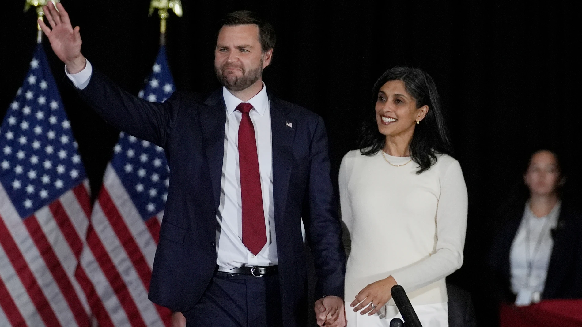 Republican vice presidential nominee Sen. JD Vance, R-Ohio, left, arrives to speak with his wife, Usha Vance, right, at a campaign event Monday, Nov. 4, 2024, in Atlanta. (AP Photo/John Bazemore)