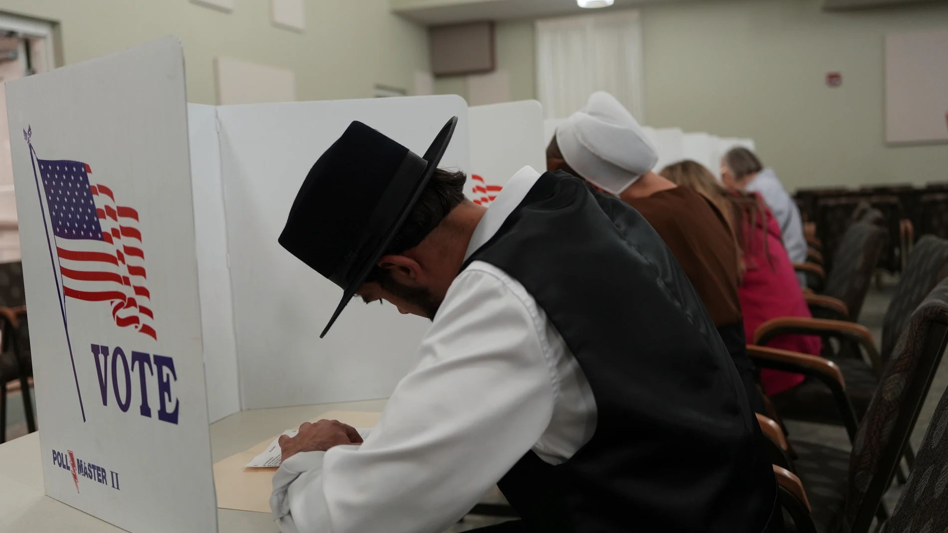 Members of the Amish community, Samuel Stoltzfus and his wife Lillian Stoltzfus, vote at a polling center at the Garden Spot Village retirement community in New Holland, Pa., Tuesday, Nov. 5, 2024. (AP Photo/Luis Andres Henao)