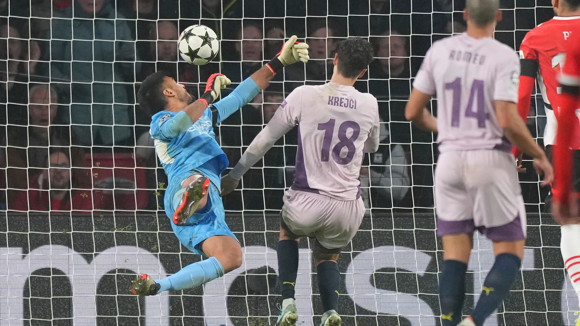 Girona's goalkeeper Paulo Gazzaniga fails to stop the fourth goal after a shot by PSV's Olivier Boscagli during the Champions League opening phase soccer match between PSV Eindhoven and Girona at Philips stadium in Eindhoven, Netherlands, Tuesday, Nov. 5, 2024. (AP Photo/Peter Dejong)