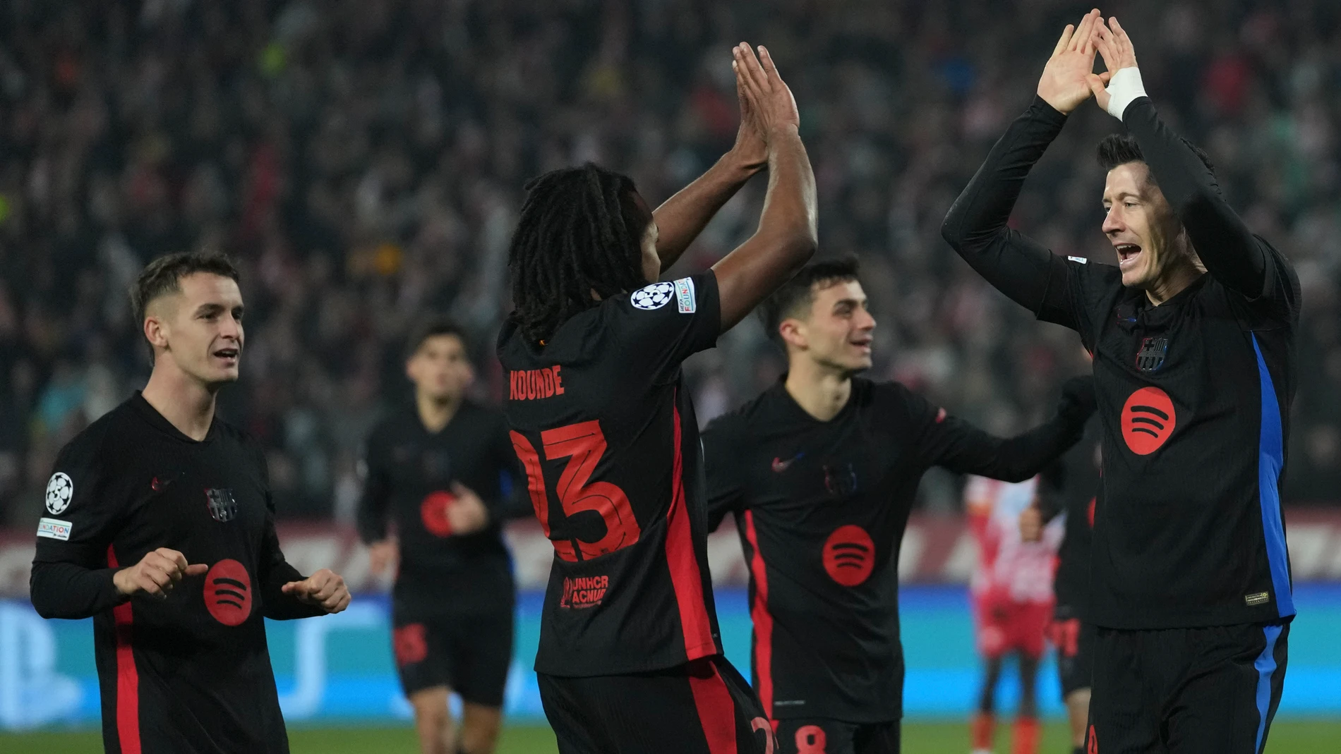 Barcelona's Robert Lewandowski, right, celebrates after scoring during the Champions League opening phase soccer match between Red Star and Barcelona at the Rajko Mitic Stadium in Belgrade, Serbia, Wednesday, Nov. 6, 2024. (AP Photo/Darko Vojinovic)