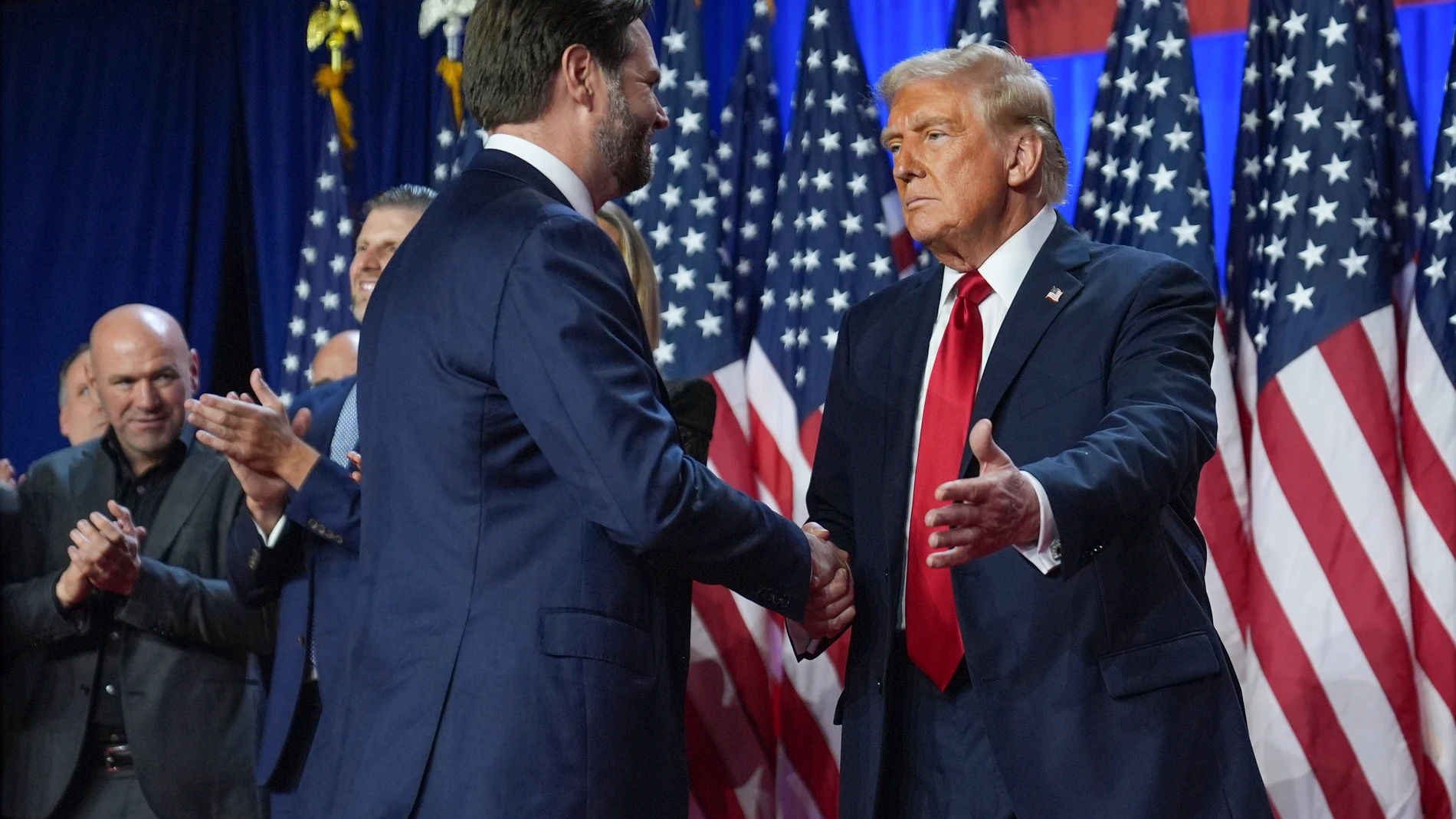 Republican presidential nominee former President Donald Trump greets Republican vice presidential nominee Sen. JD Vance, R-Ohio, at an election night watch party at the Palm Beach Convention Center, Wednesday, Nov. 6, 2024, in West Palm Beach, Fla. (AP Photo/Evan Vucci)