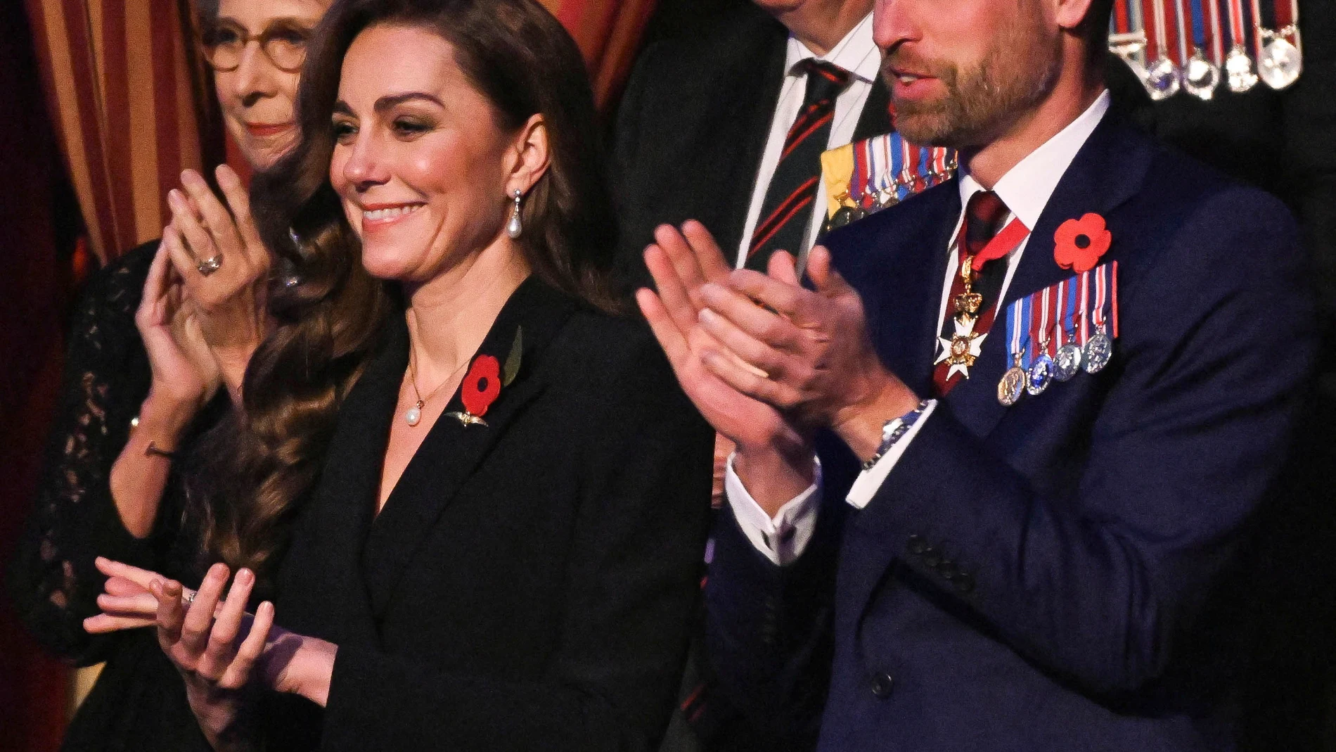Britain's Catherine, Princess of Wales, left, and Britain's Prince William applaud as they attend the Royal British Legion Festival of Remembrance at the Royal Albert Hall in London, Saturday Nov. 9, 2024. (Chris J. Ratcliffe/Pool Photo via AP)