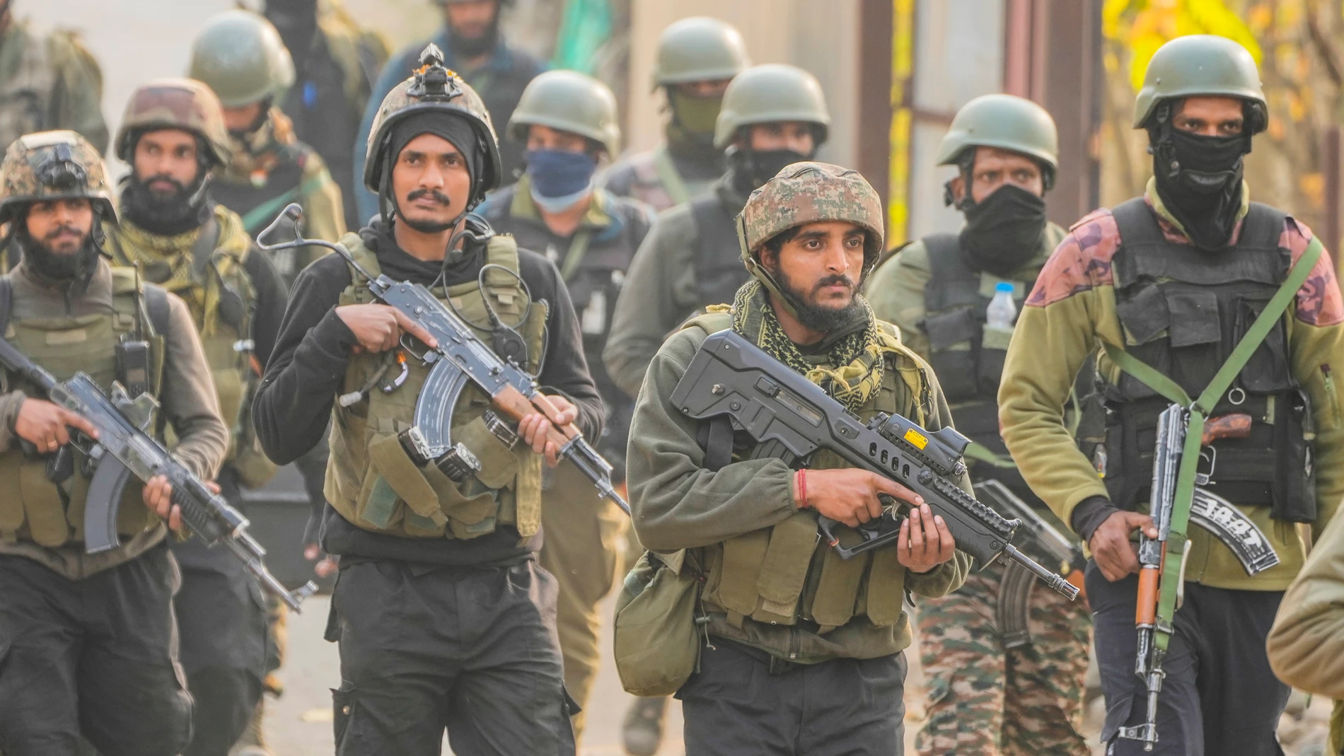 Indian soldiers attend a search operation after a gunfight with suspected militants on the outskirts of Srinagar, Indian controlled Kashmir, Sunday, Nov. 10, 2024. (AP Photo/Mukhtar Khan)