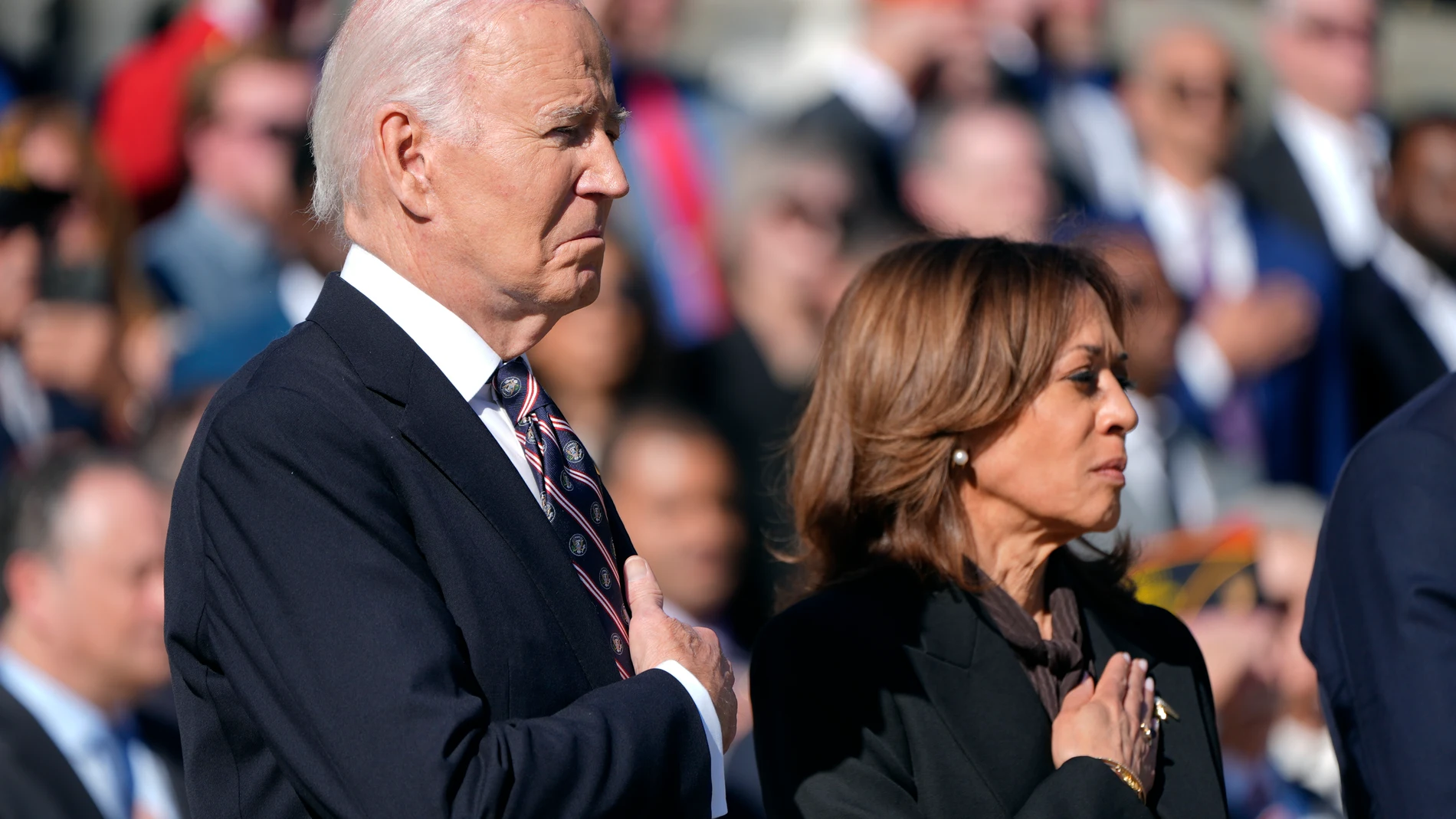 President Joe Biden, left, and Vice President Kamala Harris look on during a wreath laying ceremony at the Tomb of the Unknown Soldier on National Veterans Day Observance at Arlington National Cemetery in Arlington, Va., Monday, Nov. 11, 2024. (AP Photo/Mark Schiefelbein)