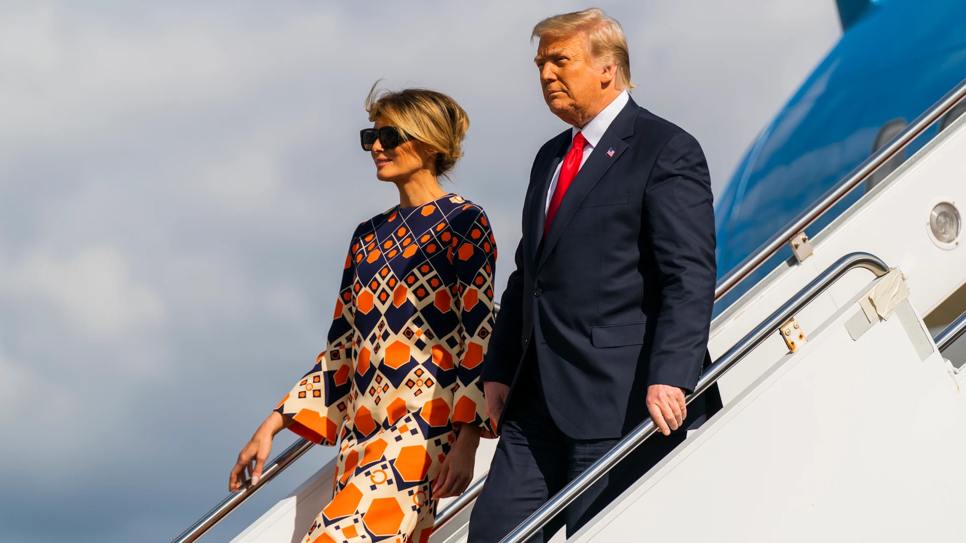 FILE - Former President Donald Trump, right, and Melania Trump disembark from their final flight on Air Force One at Palm Beach International Airport in West Palm Beach, Fla., Jan. 20, 2021. (AP Photo/Manuel Balce Ceneta, File)