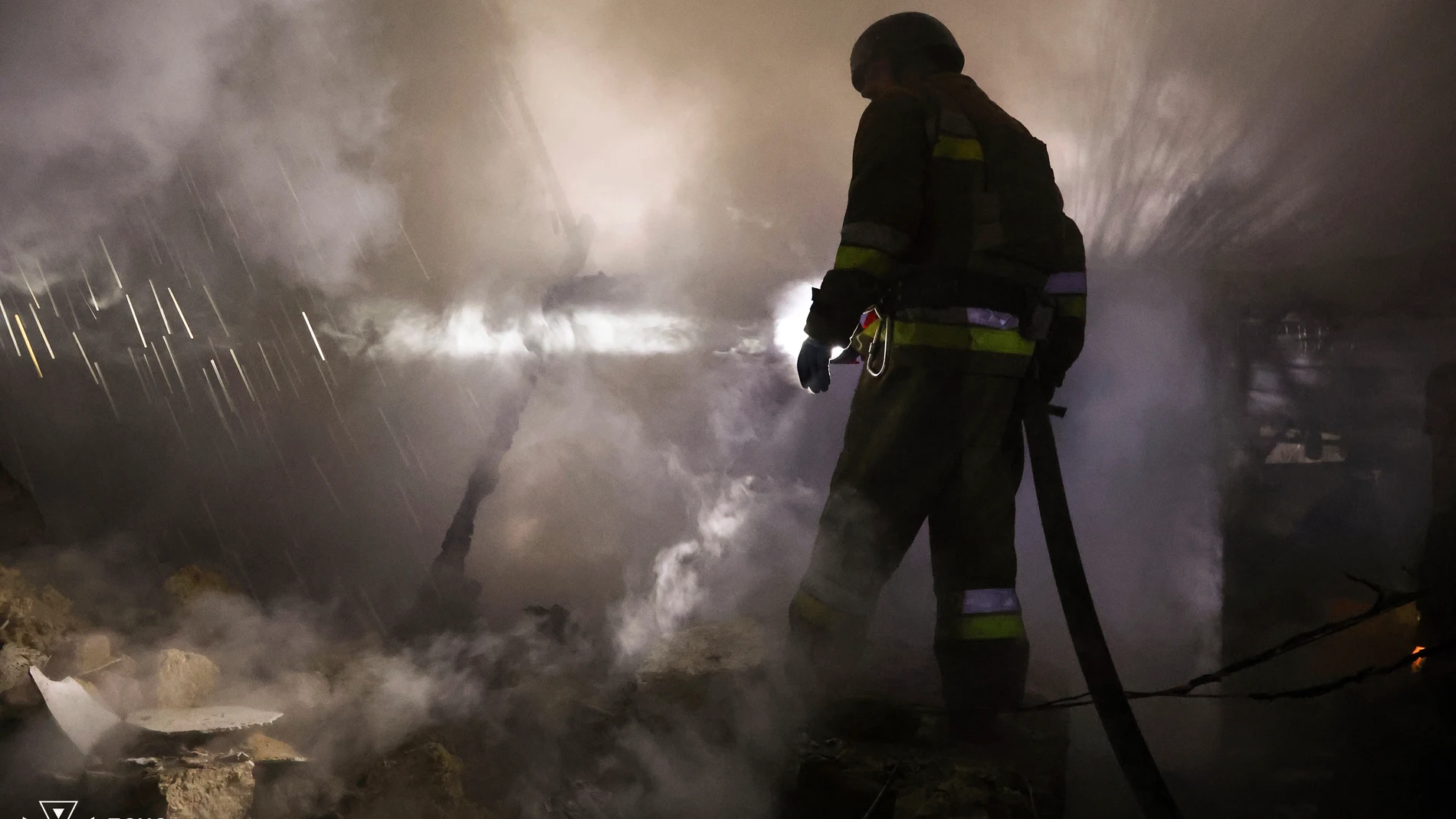In this image provided by the Ukrainian Emergency Service on Monday, Nov. 11, 2024, a firefighter works on a site of a Russian attack on residential area in Mykolaiv, Ukraine. (Ukrainian Emergency Service via AP)