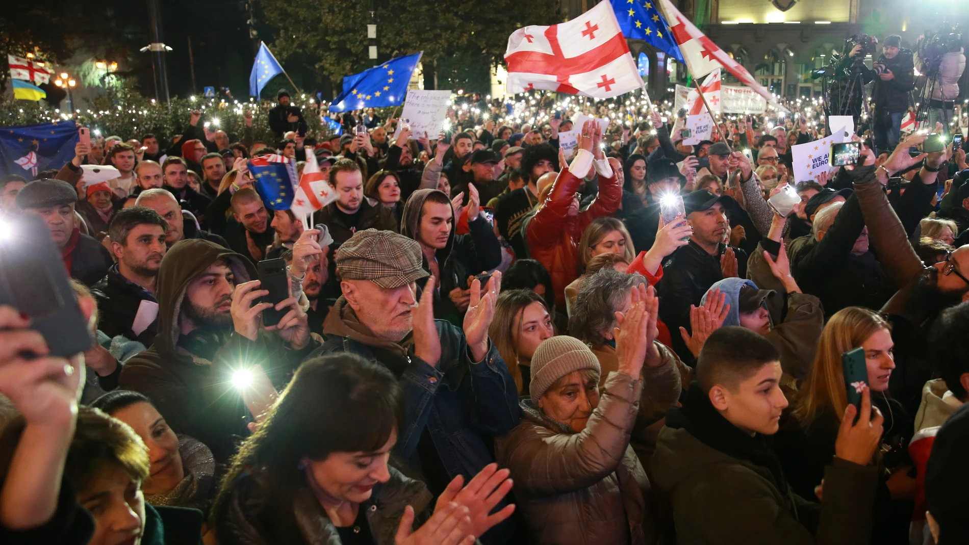 People attend a rally to protest against alleged violations in a recent parliamentary election in Tbilisi, Georgia, Monday, Nov. 11, 2024. (AP Photo/Zurab Tsertsvadze)