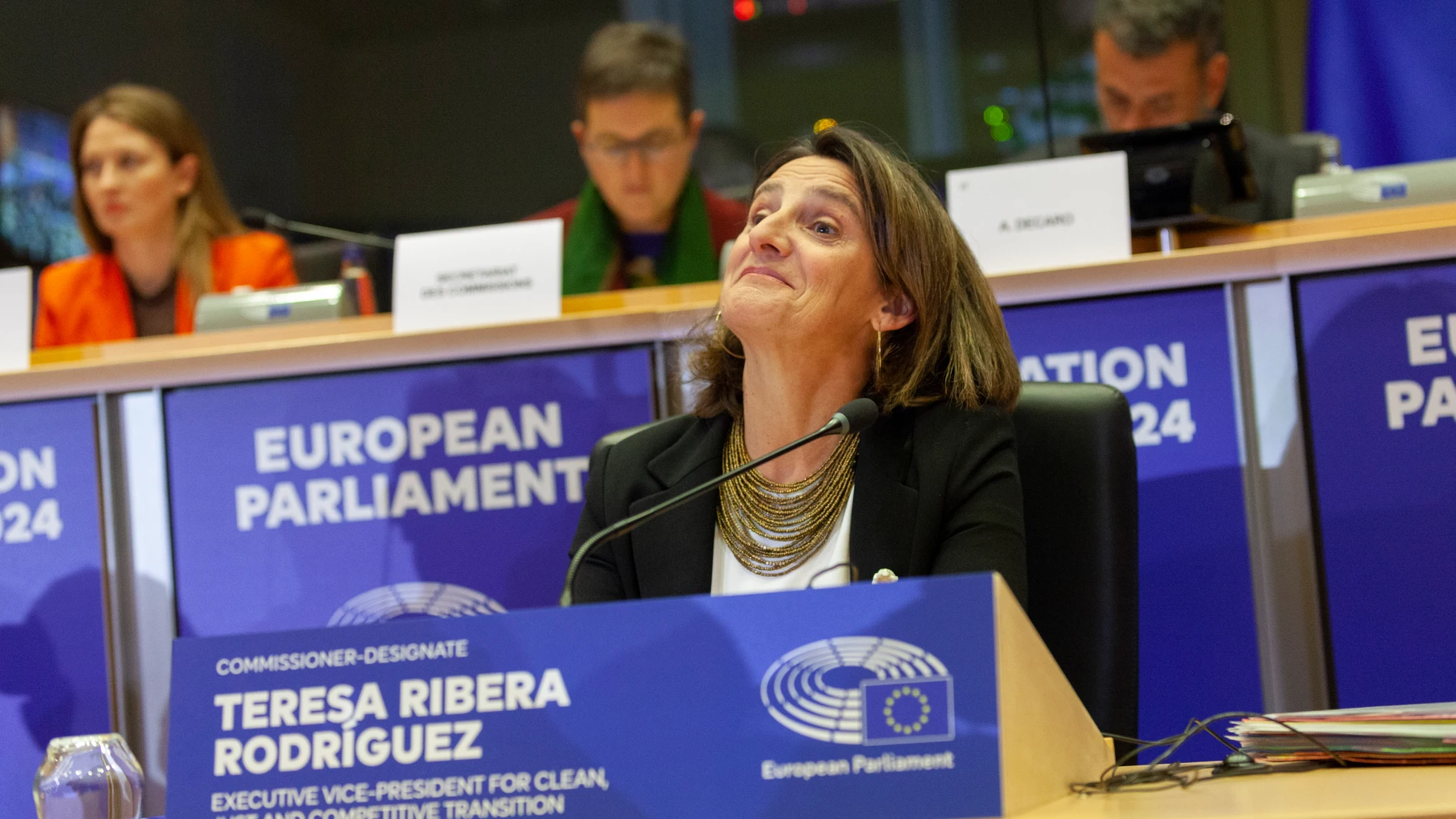 La candidata a la vicepresidencia ejecutiva de Transición Limpia, Justa y Competitiva, y a la cartera de Competencia de la Comisión Europea, Teresa Ribera, durante su intervención en el Parlamento Europeo en el proceso de audiencia para la confirmación de su candidatura a la Comisión Europea, en el Parlamento Europeo, a 12 de noviembre de 2024, en Bruselas (Bélgica). ara asumir el puesto que le ha encargado la presidenta de la Comisión, Ursula von der Leyen, Ribera debe responder antes a las...