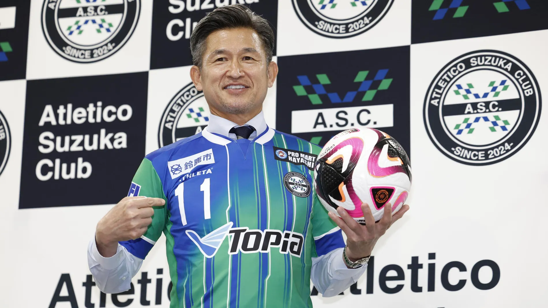 Kazuyoshi Miura, a 57-year-old former forward of Japan's national football team, poses at a press conference at National Stadium in Tokyo on June 25, 2024, as Atletico Suzuka announced that he has rejoined the fourth-tier club. (Kyodo News via AP)