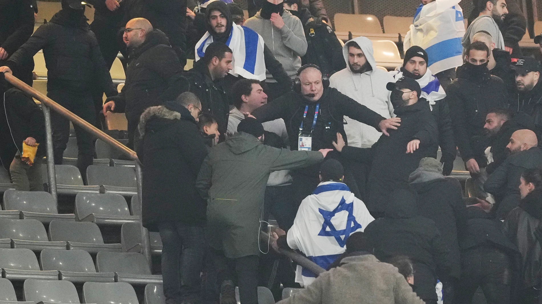 Fans argue on stands during the UEFA Nations League soccer match between France and Israel at the Stade de France stadium in Saint-Denis, outside Paris, Thursday Nov. 14, 2024. (AP Photo/Thibault Camus)