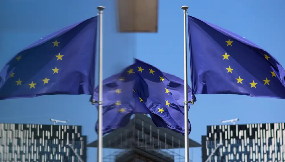 European Union flags fly in front of European Commission headquarters in the European district of Brussels, Belgium.