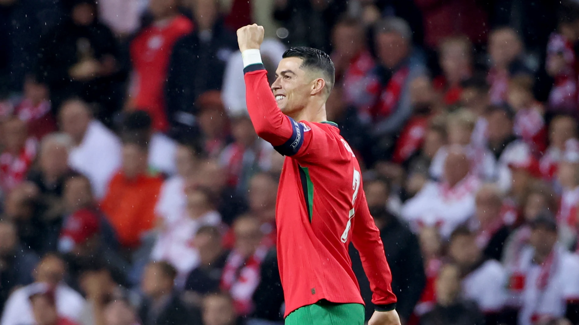 Portugal's Cristiano Ronaldo celebrates after scoring his side's second goal from the penalty spot during the UEFA Nations League soccer match between Portugal and Poland at the Dragao stadium in Porto, Portugal, Friday, Nov. 15, 2024. (AP Photo/Luis Vieira)