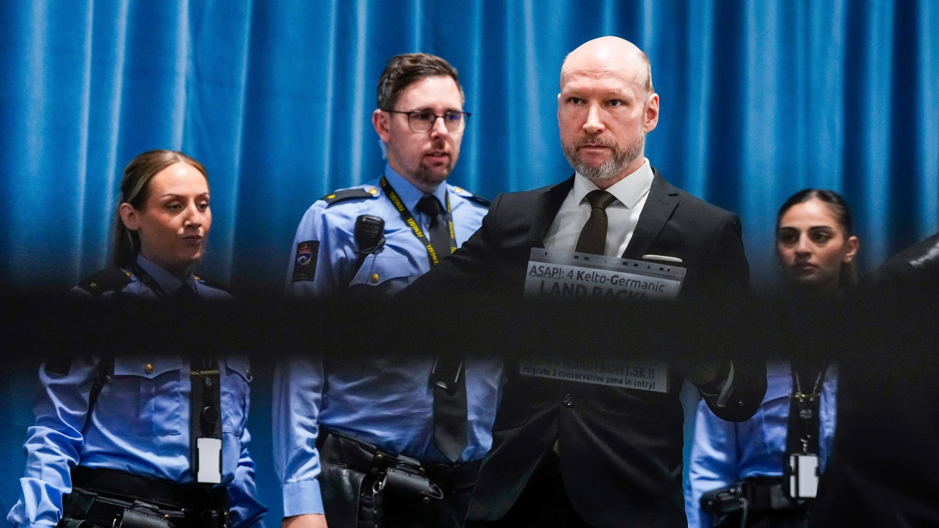 Anders Behring Breivik arrives at the courtroom for day one of the Ringerike, Asker and Bærum district court's processing of Fjotolf Hansen's petition for parole, in Tyristrand, Norway, Tuesday, Nov. 19, 2024. (Beate Oma Dahle/NTB Scanpix via AP)