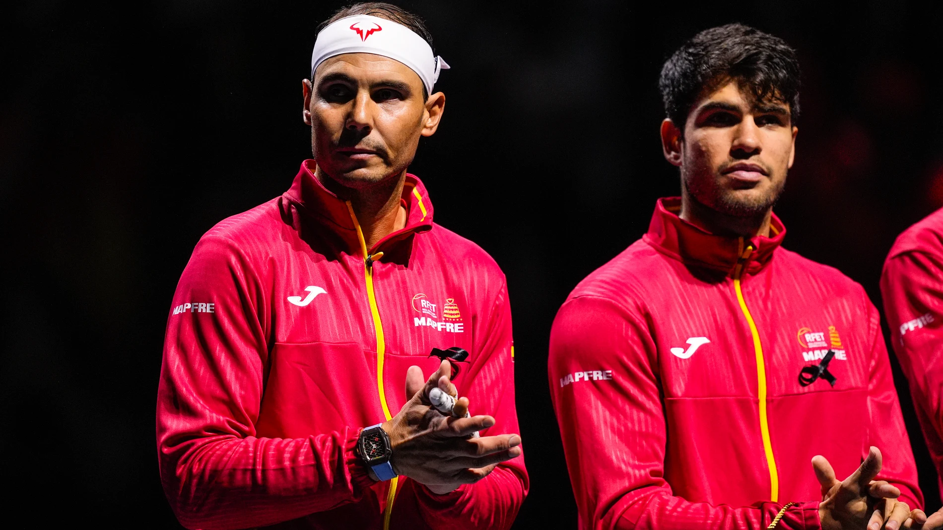 Carlos Alcaraz of Spain and Rafael Nadal of Spain gesture during the Davis Cup 2024 tennis match played between Spain and Netherlands at Martin Carpena Pavilion on November 19, 2024, in Malaga, Spain AFP7 19/11/2024 ONLY FOR USE IN SPAIN