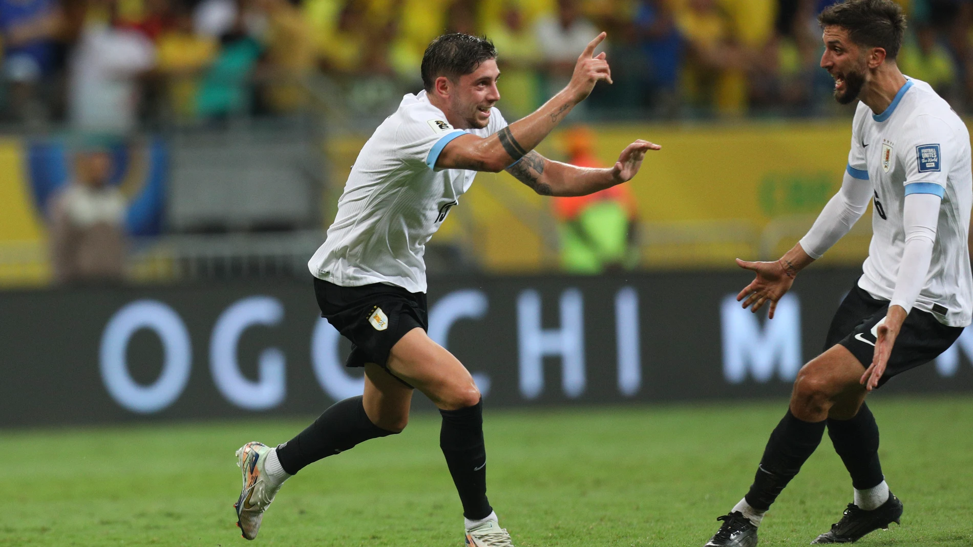 Uruguay's Federico Valverde, left, celebrates scoring his side's opening goal against Brazil during a qualifying soccer match for the FIFA World Cup 2026 at Arena Fonte Nova in Salvador, Brazil, Tuesday, Nov.19, 2024.(AP Photo/Raphael Muller)