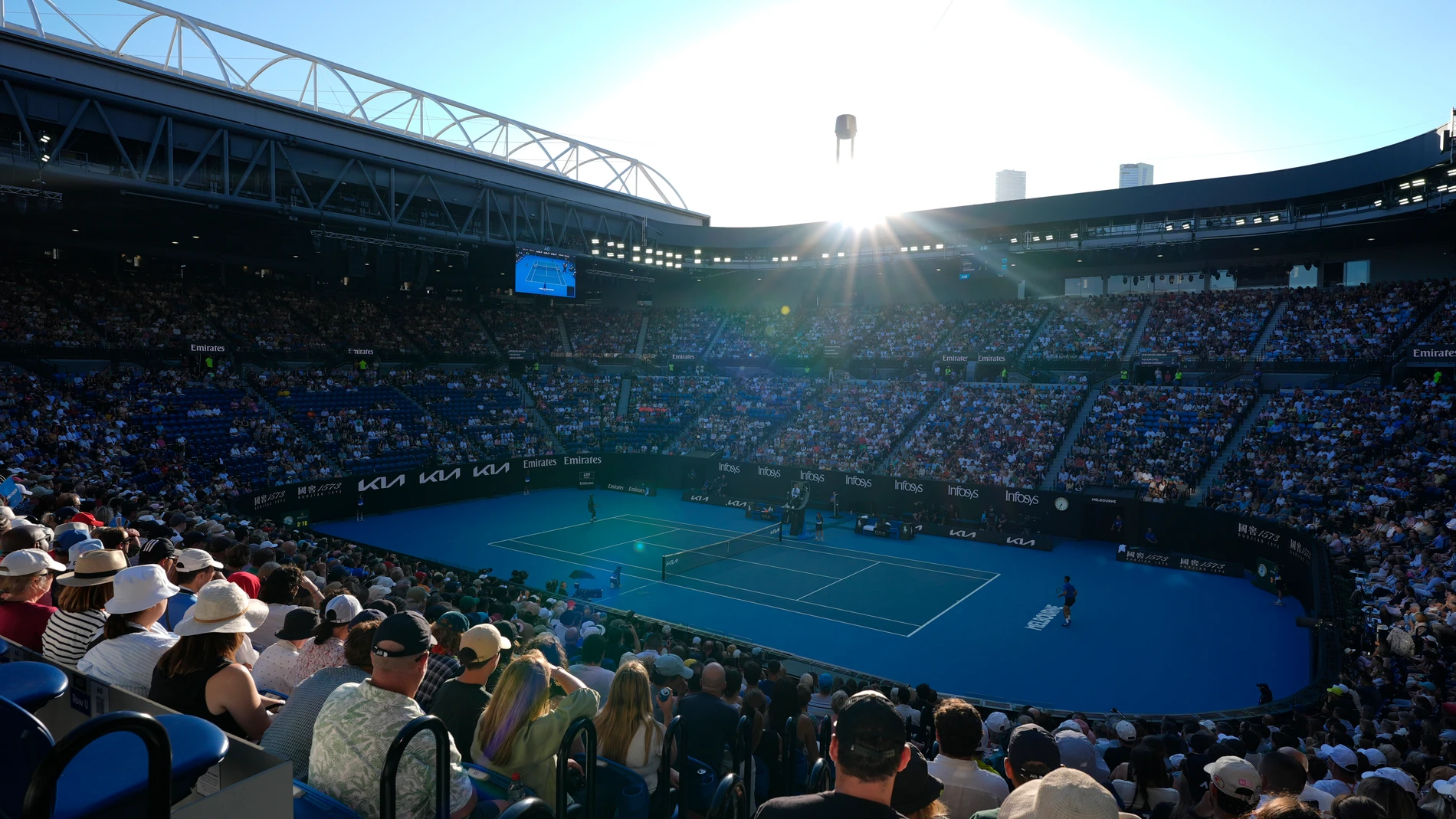 Spectators watch Novak Djokovic of Serbia and Nishesh Basavareddy of the U.S. during their first round match on Rod Laver Arena at the Australian Open tennis championship in Melbourne, Australia, Monday, Jan. 13, 2025. (AP Photo/Asanka Brendon Ratnayake)