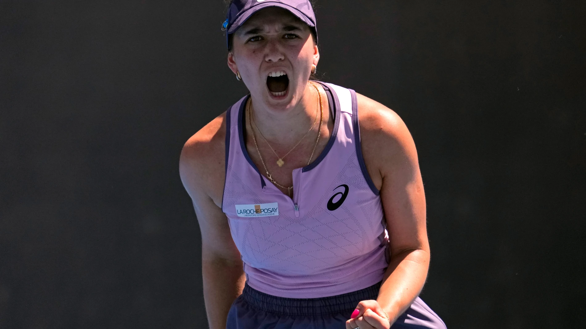 Eva Lys of Germany reacts after winning a point against Jaqueline Cristian of Romania during their third round match at the Australian Open tennis championship in Melbourne, Australia, Saturday, Jan. 18, 2025. (AP Photo/Vincent Thian)